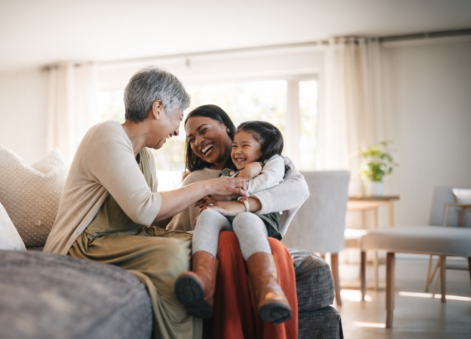 Three generations of a family sharing a joyful moment, hearing made effortless